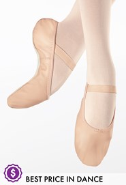 Ballerina legs in striped socks and pointe shoes dance light